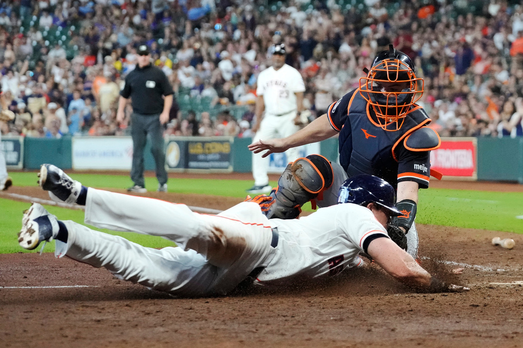 Detroit Tigers catcher Jake Rogers tags out Houston Astros' Jake Meyers at the plate during the sixth inning of a baseball game, Wednesday, June 17, 2026, in Houston. (AP Photo/Kevin M. Cox)
