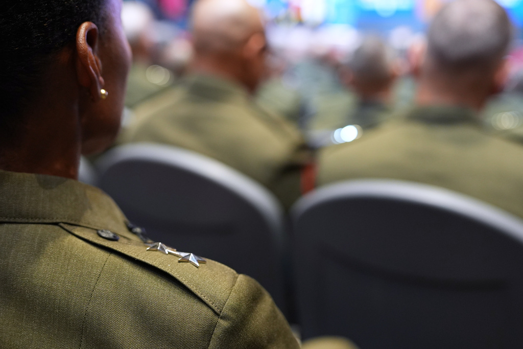 U.S. military senior leadership listen as President Donald Trump speaks at Marine Corps Base Quantico, Tuesday, Sept. 30, 2025 in Quantico, Va. (AP Photo/Evan Vucci)