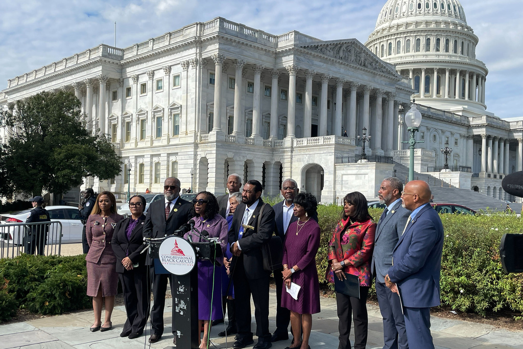 Members of the Congressional Black Caucus speak outside the U.S. Capitol after arguments were heard on the Voting Rights Act at the Supreme Court in Washington, Wednesday, Oct. 15, 2015. (AP Photo/Matt Brown)