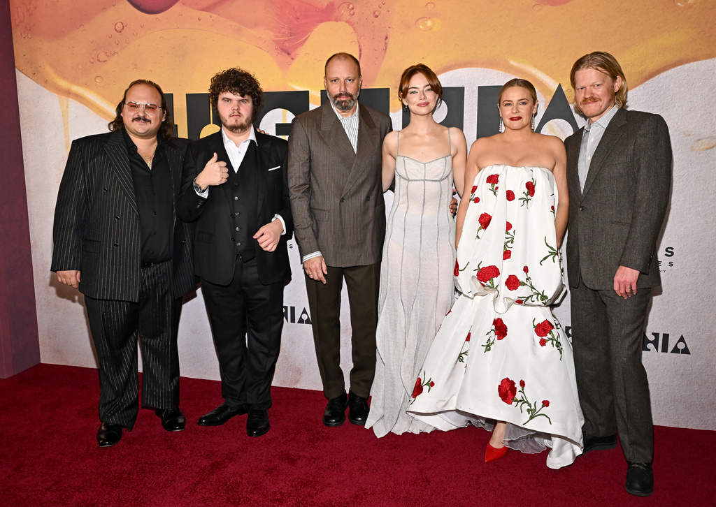 Stavros Halkias, from left, Aidan Delbis, Yorgos Lanthimos, Emma Stone, Alicia Silverstone and Jesse Plemons attend the premiere of "Bugonia" at The Museum of Modern Art on Tuesday, Oct. 21, 2025, in New York. (Photo by Evan Agostini/Invision/AP)