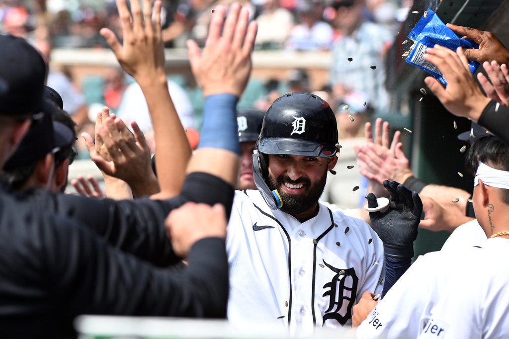 Detroit Tigers' Riley Greene, middle, is congratulated after hitting a two-run home run during the first inning of a baseball game against the Colorado Rockies, Sunday, Sept. 13, 2026, in Detroit. (AP Photo/Jose Juarez)