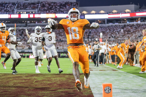 Tennessee running back DeSean Bishop (18) scores the go-ahead touchdown against Mississippi State during the overtime of an NCAA college football game in Starkville, Miss., Saturday, Sept. 27, 2025. (AP Photo/James Pugh) Tennessee running back DeSean Bishop (18) scores the go-ahead touchdown against Mississippi State during the overtime of an NCAA college football game in Starkville, Miss., Saturday, Sept. 27, 2025. (AP Photo/James Pugh)