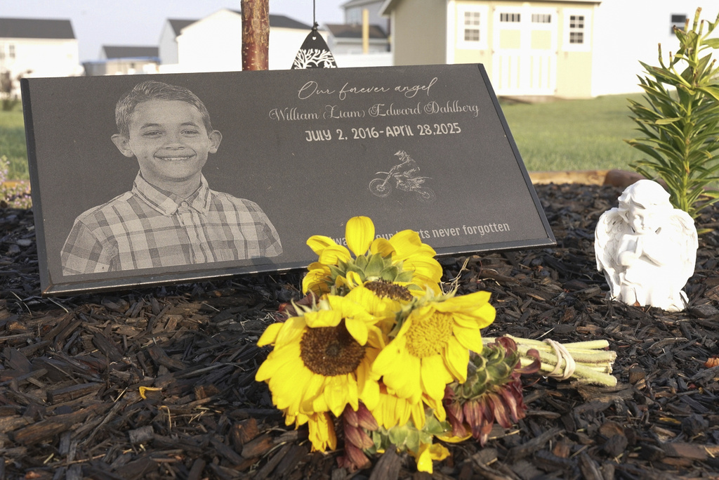 Liam Dahlberg's memorial sits in his family's front yard in Lowell, Ind., on Wednesday, Aug. 13, 2025. (AP Photo/Laura Bargfeld)