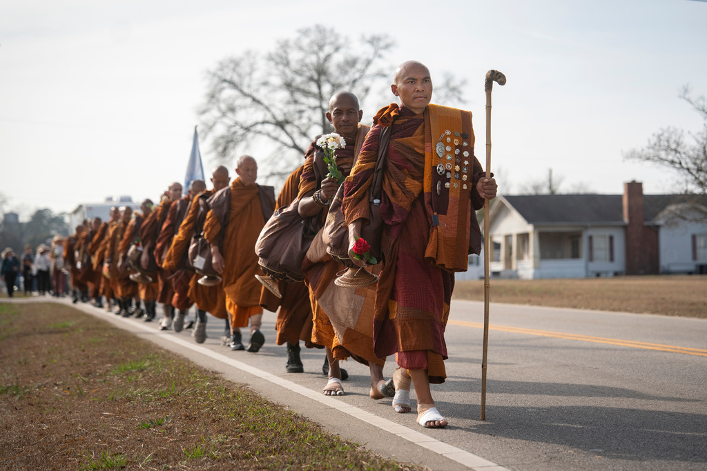 FILE - Bhikkhu Pannakara leads other buddhist monks while they participate in the, "Walk For Peace," in Saluda, S.C., Jan. 8, 2026. (AP Photo/Allison Joyce, File)