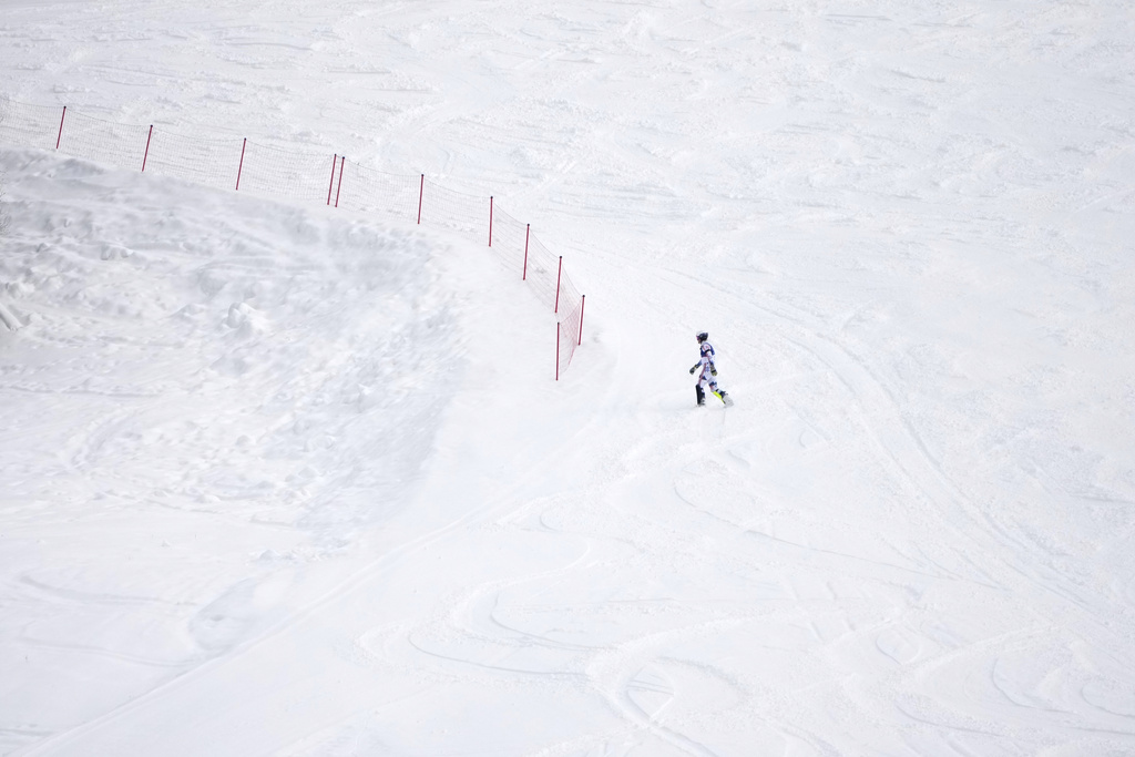 Norway's Atle Lie McGrath walks off the course after skiing out during an alpine ski, men's slalom race, at the 2026 Winter Olympics, in Bormio, Italy, Monday, Feb. 16, 2026. (AP Photo/John Locher)