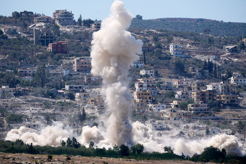 Smoke billows from an Israeli-controlled detonation in the village of Mansouri, as is seen from Hanniyeh village, southern Lebanon, Friday, Sept. 11, 2026. (AP Photo/Hussein Malla)