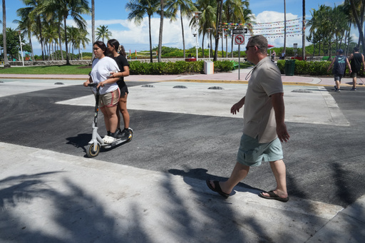 Pedestrians walk over a crosswalk on Miami Beach's iconic Ocean Drive that used to be rainbow-colored celebrating the history and contributions of the LGBTQ+ community, Monday, Oct. 6, 2025. (AP Photo/Marta Lavandier) Pedestrians walk over a crosswalk on Miami Beach's iconic Ocean Drive that used to be rainbow-colored celebrating the history and contributions of the LGBTQ+ community, Monday, Oct. 6, 2025. (AP Photo/Marta Lavandier)