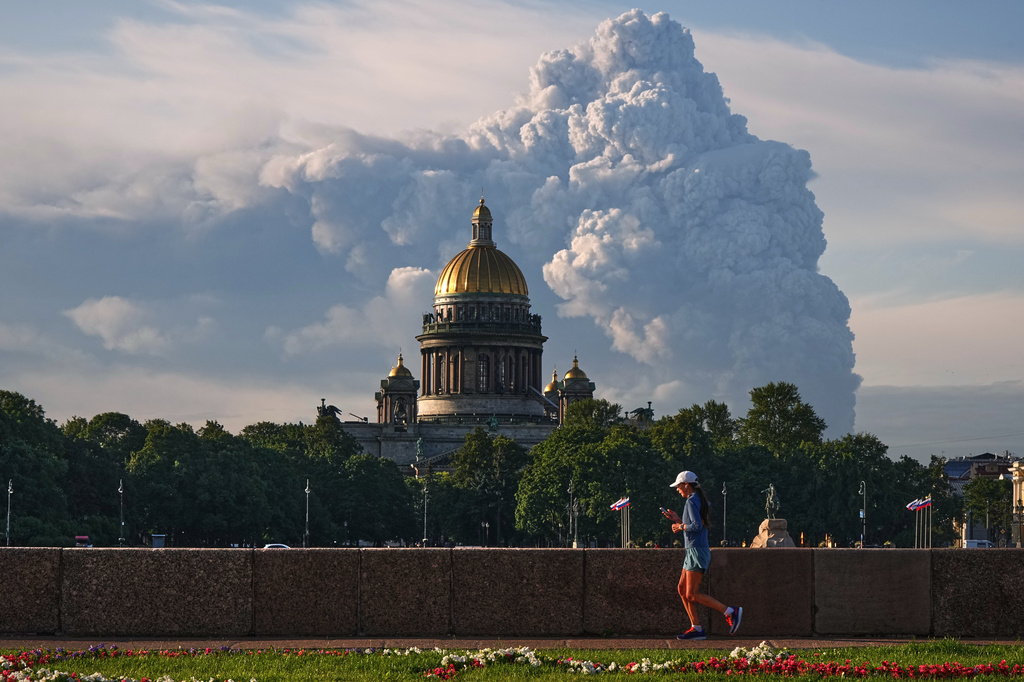 FILE - Smoke rises following a Ukrainian drone attack on a warehouse for online retailer Wildberries in St. Petersburg, Russia on Friday, July 24, 2026, with St. Isaac's Cathedral seen in foreground. (UGC via AP, File)