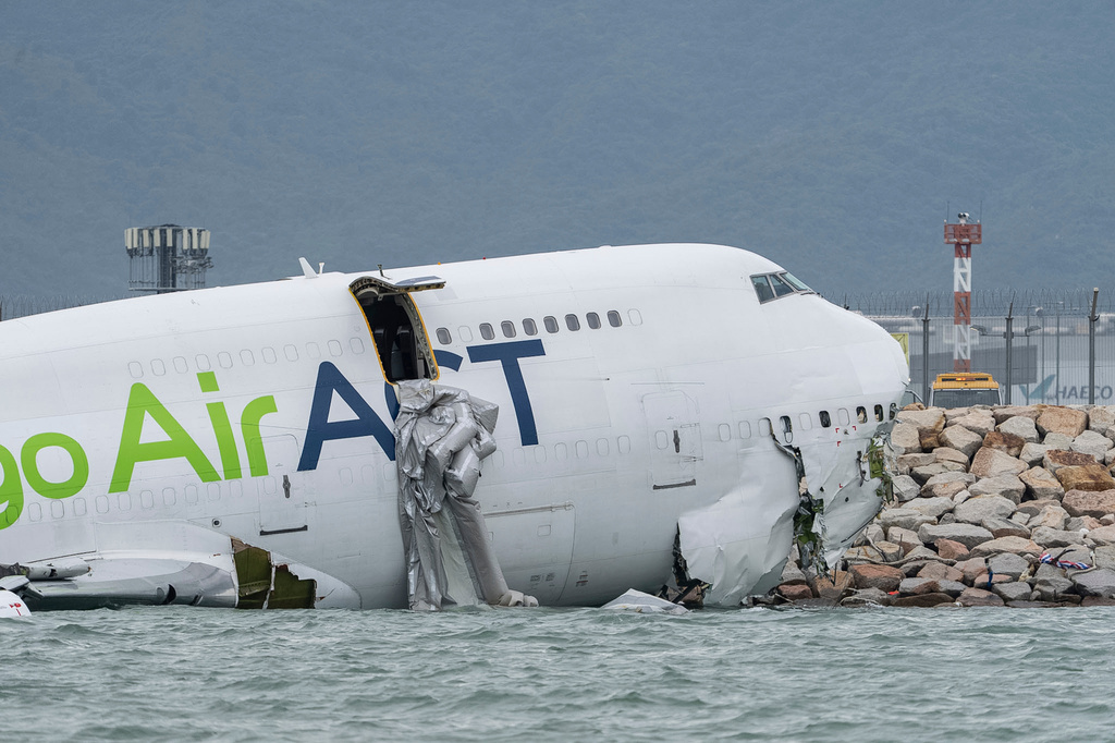 A view of the cargo aircraft that skidded off a Hong Kong runway on Monday, Oct. 20, 2025. (AP Photo/Chan Long Hei)
