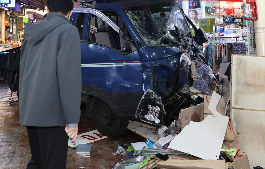 A truck crashes at a market in Bucheon, South Korea, Thursday, Nov. 13, 2025. (Lim Soon-suck/Yonhap via AP)