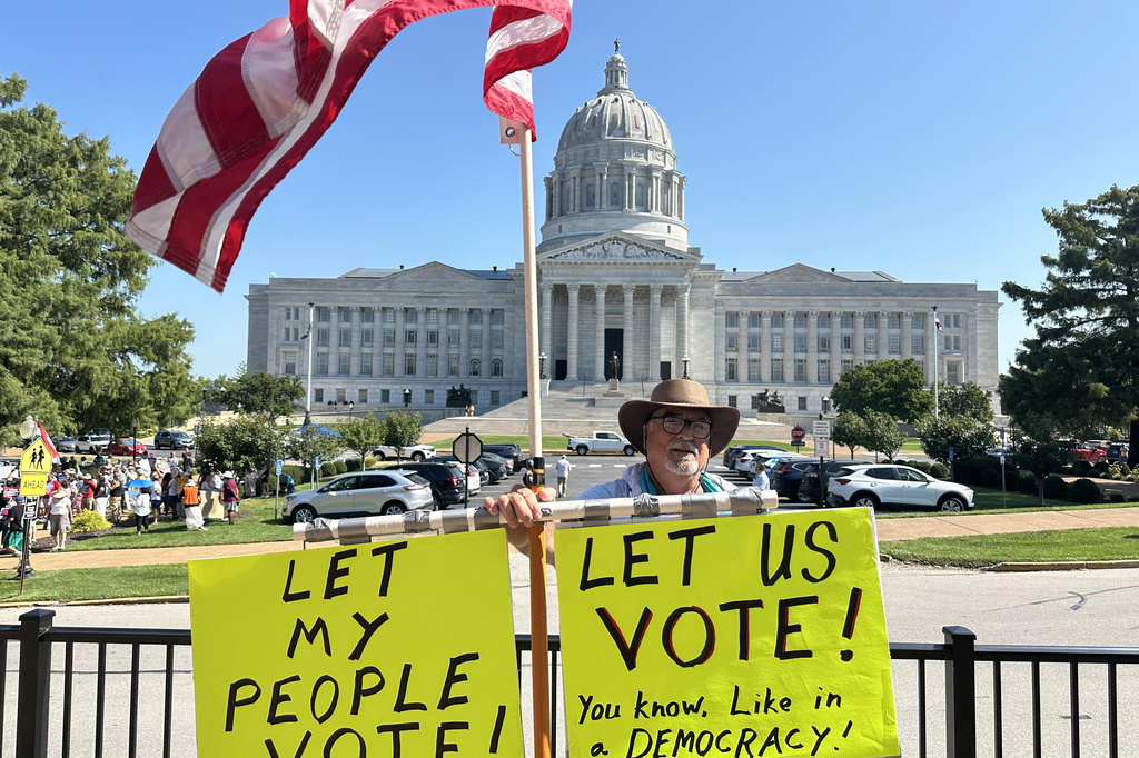 In this photo taken with a smartphone, Steve Dakopolos demonstrates in front of the state Capitol in Jefferson City, Mo., Wednesday, Sept. 2, 2026, in support of a referendum petition seeking a statewide vote on a congressional redistricting plan. (AP Photo/David A. Lieb)