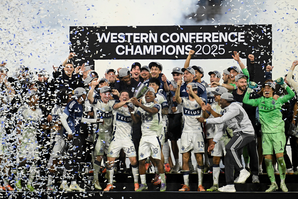 Vancouver Whitecaps players celebrate after winning the MLS Western Conference final soccer match against San Diego FC, Saturday, Nov. 29, 2025, in San Diego. (AP Photo/Denis Poroy)