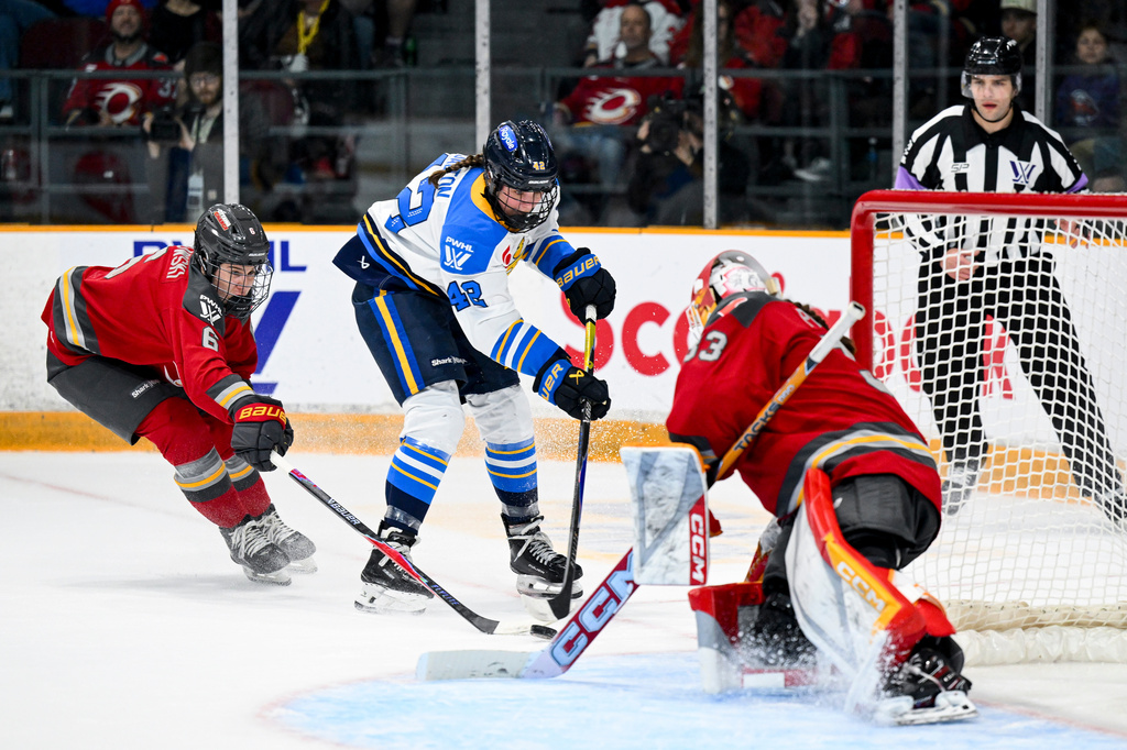 Toronto Sceptres' Claire Dalton (42) takes a shot on Ottawa Charge's goaltender Gwyneth Philips (33) during the second period of a PWHL hockey game in Ottawa, Ontario, Saturday, April 25, 2026. (Spencer Colby/The Canadian Press via AP)