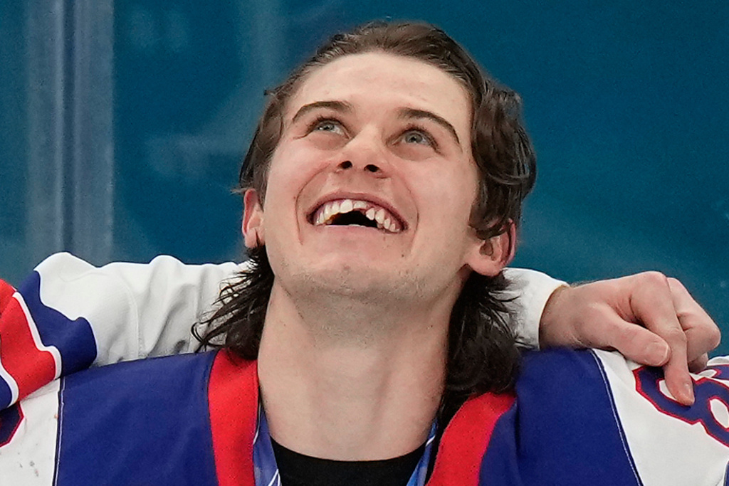 United States' Jack Hughes (86) reacts after receiving his gold medal after the USA defeated Canada in the men's ice hockey gold medal game at the 2026 Winter Olympics, in Milan, Italy, Sunday, Feb. 22, 2026. (AP Photo/Luca Bruno)
