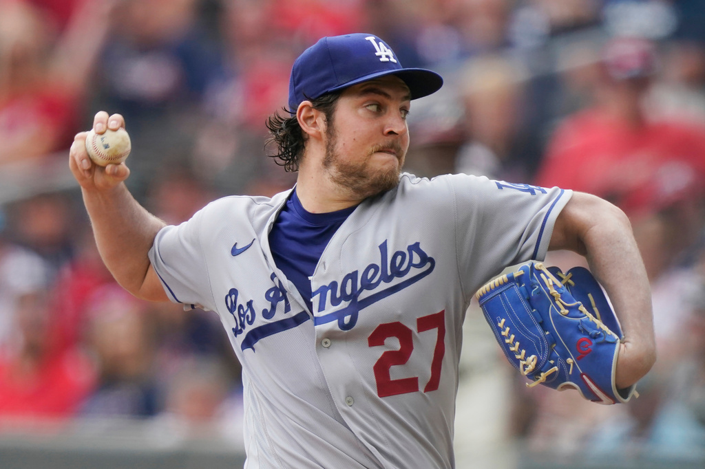 FILE - Los Angeles Dodgers starting pitcher Trevor Bauer (27) delivers in the first inning of a baseball game against the Atlanta Braves Sunday, June 6, 2021, in Atlanta. (AP Photo/Brynn Anderson, File)