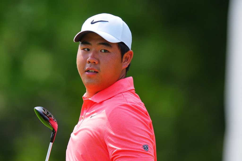 Tom Kim, of South Korea, walks after a tee shot on the sixth hole during the first round of the Charles Schwab Challenge golf tournament at Colonial Country Club in Fort Worth, Texas, Thursday, May 28, 2026. (AP Photo/LM Otero)