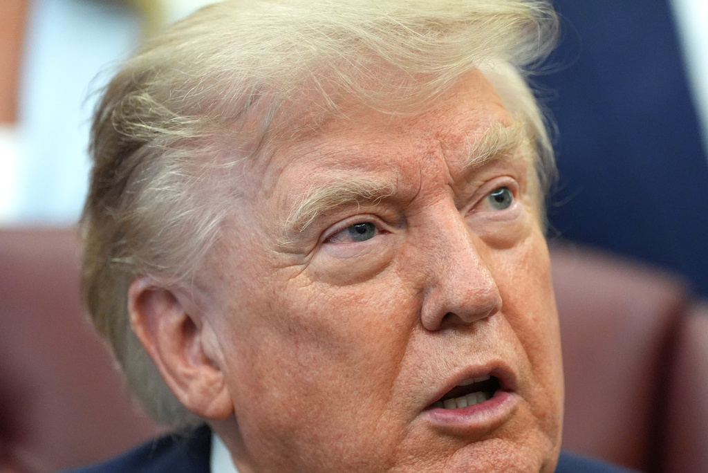 President Donald Trump speaks during a meeting about military families, in the Oval Office of the White House, Monday, Aug. 3, 2026, in Washington. (AP Photo/Alex Brandon)