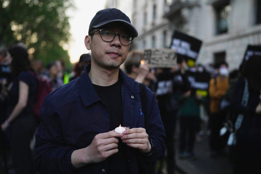FILE - Hong Kong activist Nathan Law attends a candlelight vigil outside the Chinese Embassy in London on June 4, 2023, to mark the anniversary of China's bloody 1989 crackdown on pro-democracy protests in Beijing's Tiananmen Square. (AP Photo/Kin Cheung, File)