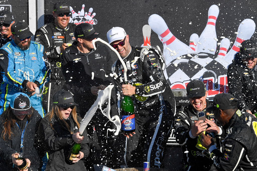 Shane Van Gisbergen, center, celebrates with his team after winning a NASCAR Cup Series auto race, Sunday, May 10, 2026, in Watkins Glen, N.Y. (Photo/Adrian Kraus)