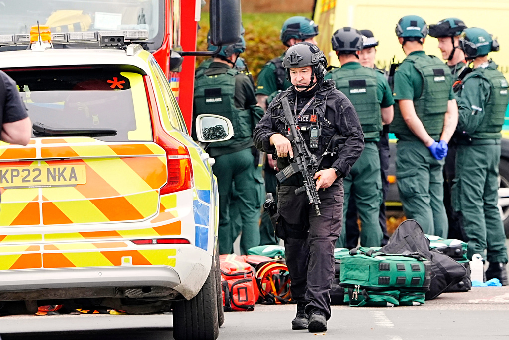 An armed police officer at the scene of a stabbing incident at Heaton Park Hebrew Congregation synagogue, in Crumpsall, Manchester, England, Thursday Oct. 2, 2025. (Peter Byrne/PA via AP)