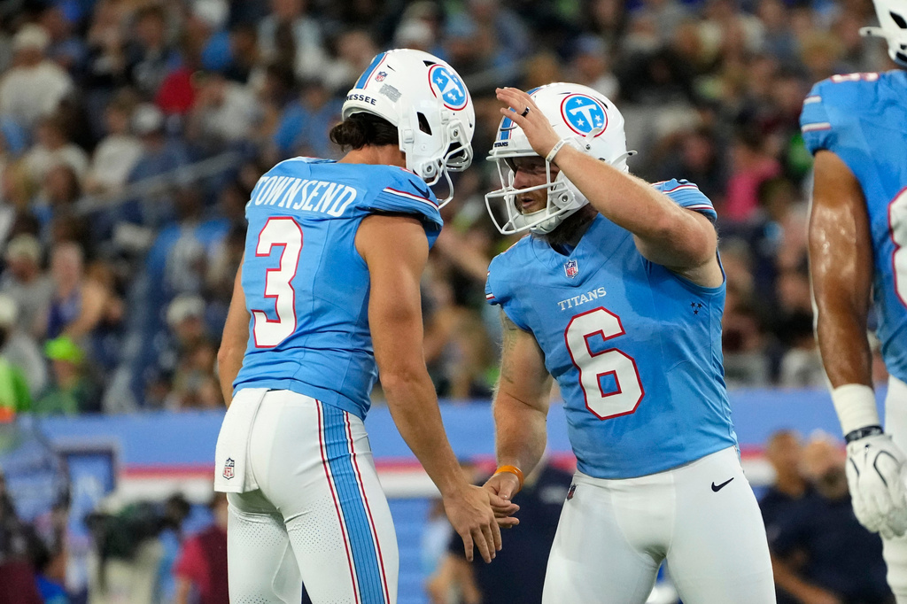 Tennessee Titans kicker Joey Slye (6) celebrates with teammate Tommy Townsend (3) after kicking a field goal during the first half of a preseason NFL football game against the Seattle Seahawks, Sunday, Aug. 23, 2026, in Nashville, Tenn. (AP Photo/George Walker IV)
