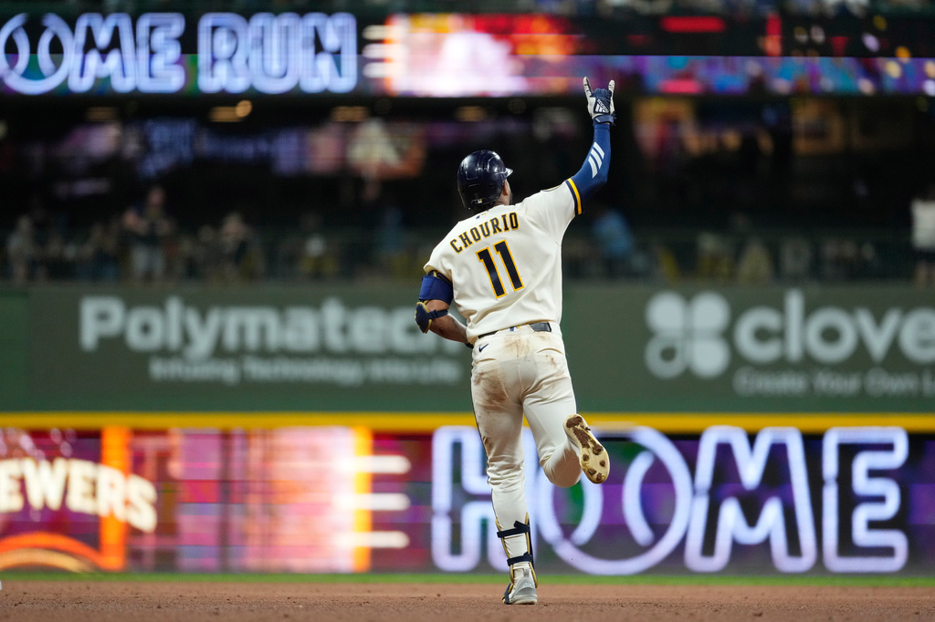 Milwaukee Brewers' Jackson Chourio gestures as he rounds the bases after hitting a two-run home during the ninth inning of a baseball game against the Chicago Cubs, Tuesday, Sept. 8, 2026, in Milwaukee. (AP Photo/Aaron Gash)