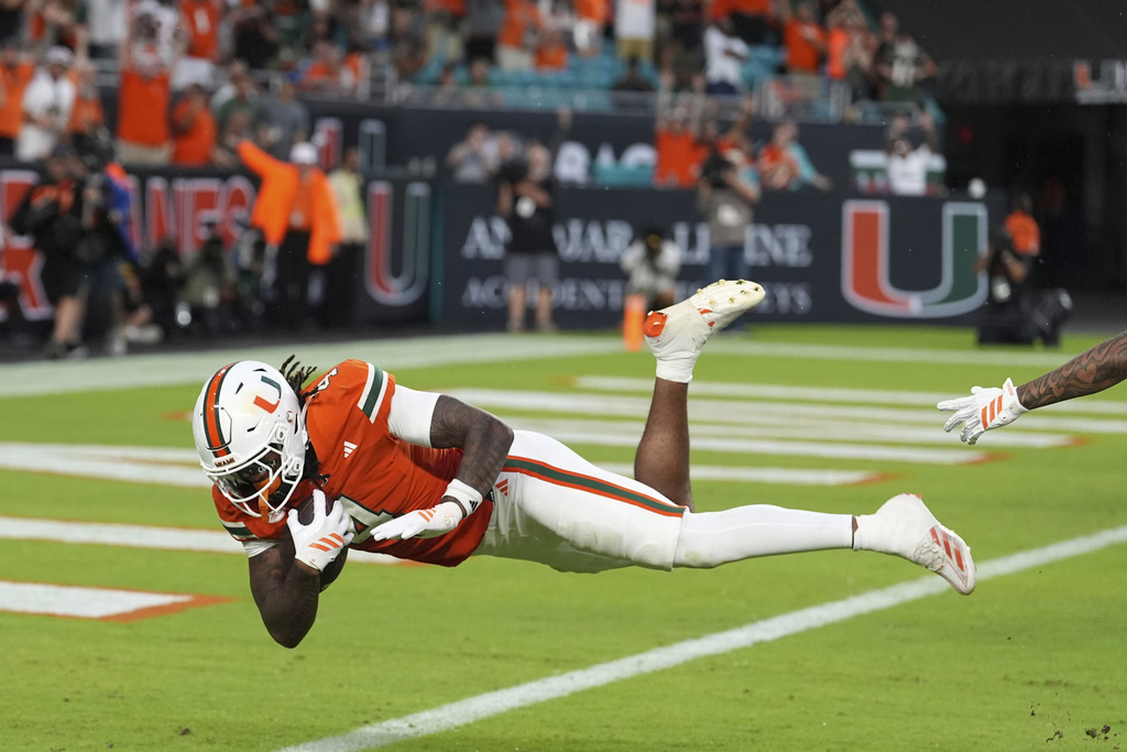 Miami running back Mark Fletcher Jr. scores a touchdown during the first half of an NCAA college football game against South Florida, Saturday, Sept. 13, 2025, in Miami Gardens, Fla. (AP Photo/Rebecca Blackwell)
