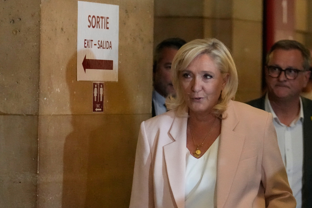 Far-right leader Marine Le Pen arrives at the courtroom for the verdict of her appeals trial, in Paris, France, Tuesday, July. 7, 2026. (AP Photo/Michel Euler)