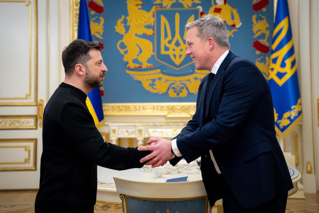 FILE - In this photo provided by the Ukrainian president's office, President Volodymyr Zelenskyy, left, shakes hands with U.S. Army Secretary Dan Driscoll in Kyiv, Ukraine, on Nov. 20, 2025. (Ukrainian Presidential Press Office via AP, File)