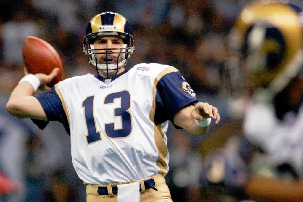 FILE - St. Louis Rams quarterback Kurt Warner looks to pass to Marshall Faulk in the first quarter during the NFL Super Bowl 36 football game against the New England Patriots, Feb. 3, 2002, in New Orleans. (AP Photo/Doug Mills, File)