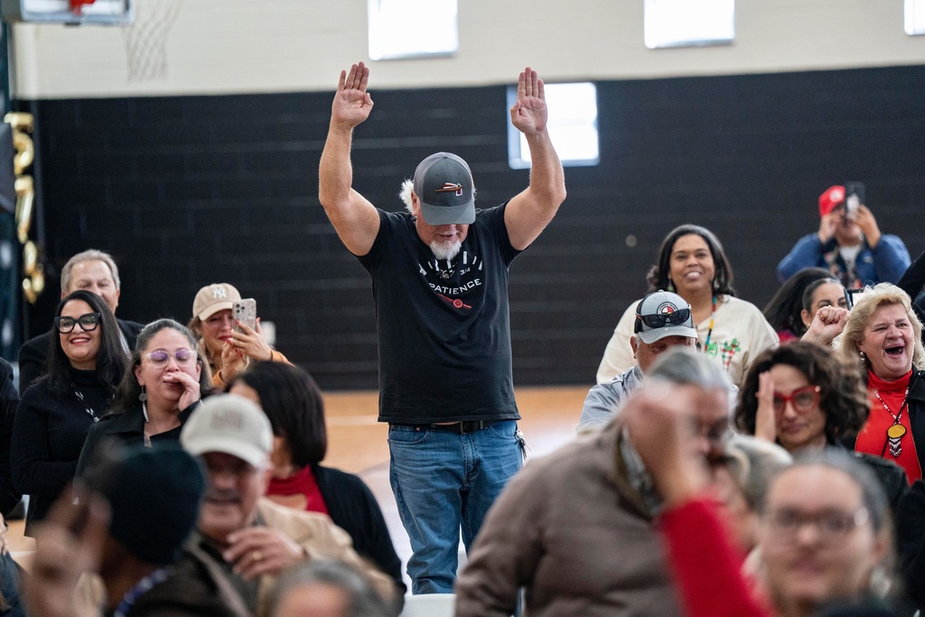 People celebrate after passage of the National Defense Authorization Act by the U.S. Senate during a watch party hosted by the Lumbee Tribe of North Carolina, Wednesday, Dec. 17, 2025, in Pembroke, N.C. (AP Photo/Allison Joyce)
