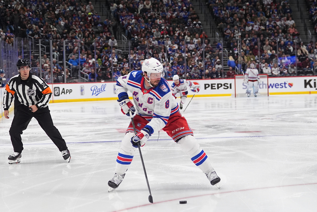 New York Rangers center J.T. Miller (8) in the second period of an NHL hockey game Thursday, Nov. 20, 2025, in Denver. (AP Photo/David Zalubowski)