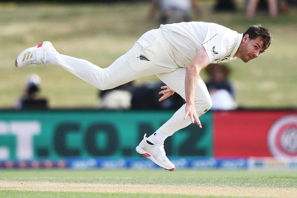 New Zealand's Jacob Duffy follows through while bowling to West Indies on Day 4 of their cricket test match in Christchurch, New Zealand, Friday, Dec. 5, 2025. (Chris Symes/Photosport via AP)