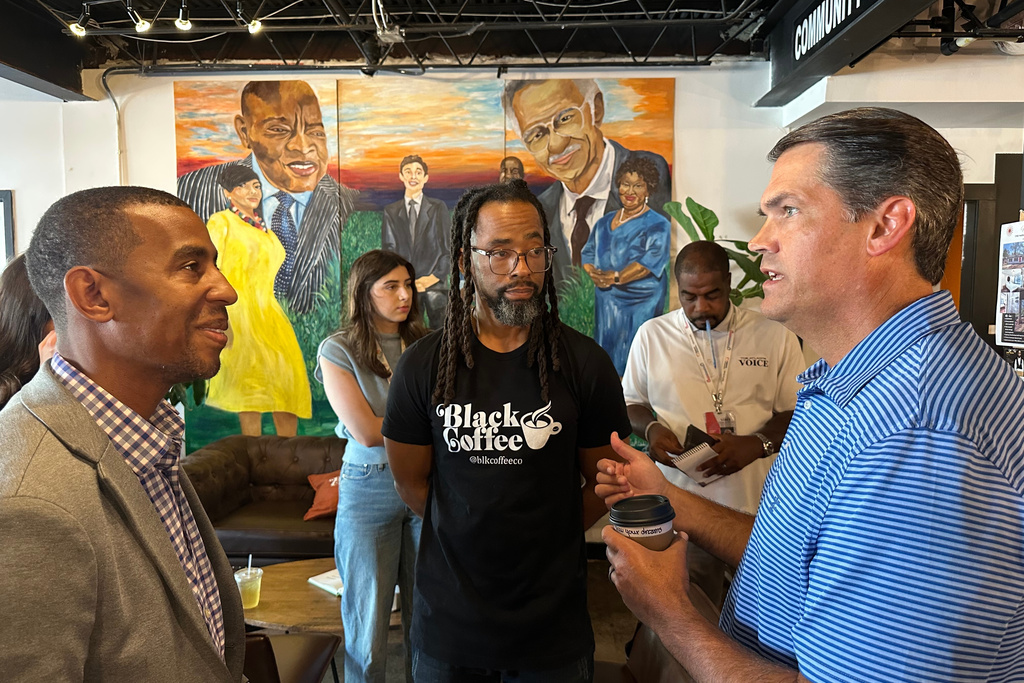 Former Republican lieutenant governor Geoff Duncan, right, speaks about his Democratic campaign for governor Wednesday, Sept. 17, 2025, at Black Coffee Co., in Atlanta. (AP Photo/Jeff Amy)