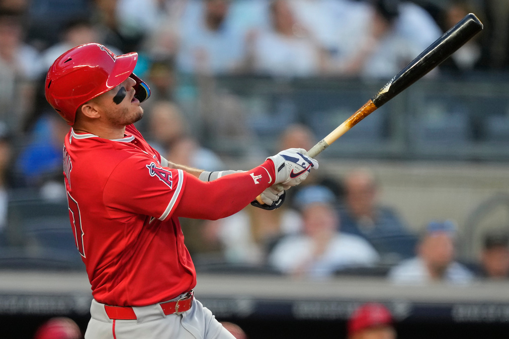 Los Angeles Angels' Mike Trout (27) hits a home run during the first inning of a baseball game against the New York Yankees, Tuesday, April 14, 2026, in New York. (AP Photo/Yuki Iwamura)