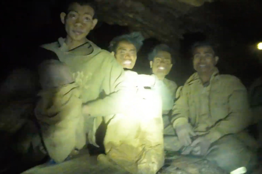 This image made from the video provided by Benz Norrased Palasing Seascout Diving shows the villagers who were trapped and found in a flooded cave in Xaisomboun province, Laos, Wednesday, May 27, 2026. (Benz Norrased Palasing Seascout Diving via AP)