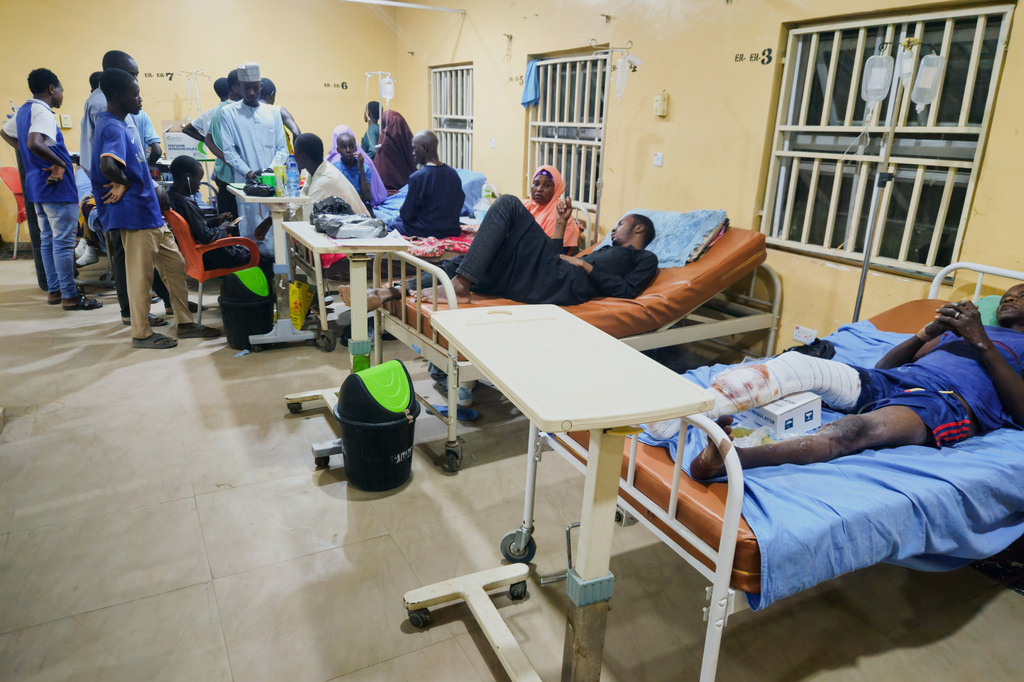 Patients receive treatment at a hospital in Damaturu after Nigerian Air Force strikes targeting jihadi rebels hit a local market Saturday in northeastern Nigeria, Sunday, April 12, 2026. (AP Photo/Micheal Abu)