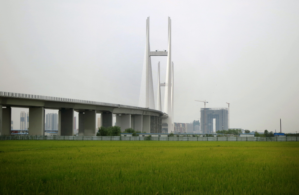 A new bridge connecting North Korea and China, seen from the North Korean side of the Yalu River border, on Sept. 2, 2014, where it touches down in rice fields in Sinuiju, North Korea. (AP Photo,File)