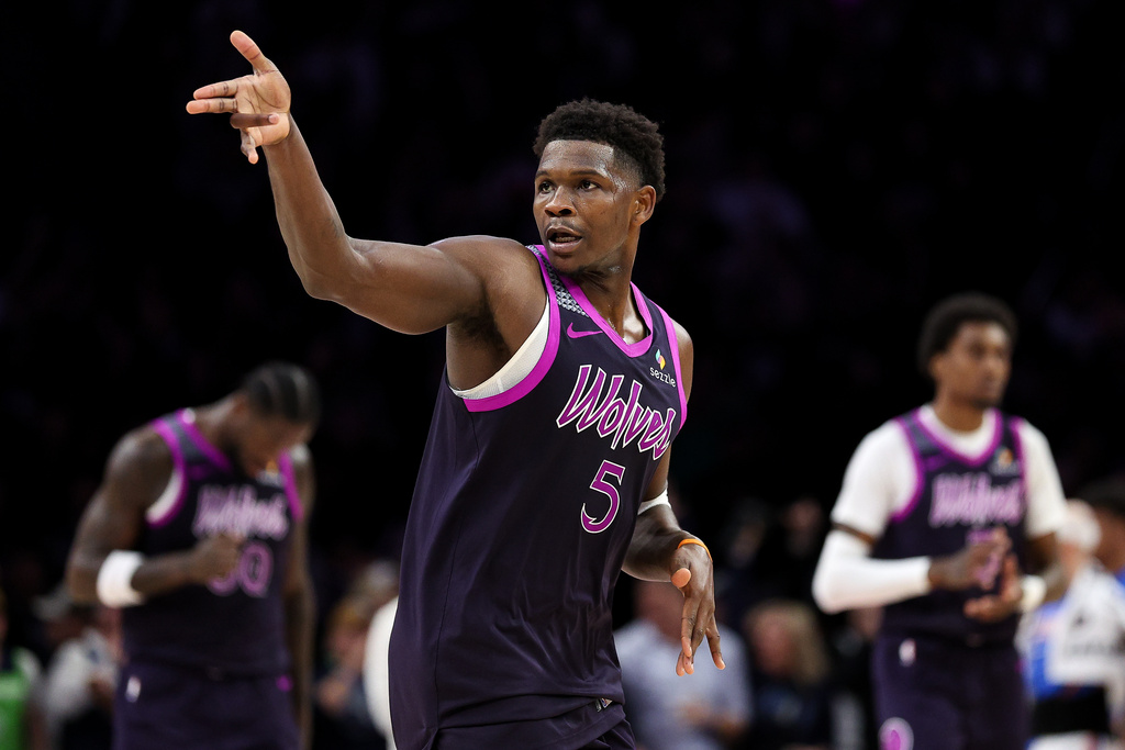 Minnesota Timberwolves guard Anthony Edwards celebrates his three-point basket against the Oklahoma City Thunder during the second half of an NBA basketball game Friday, Dec. 19, 2025, in Minneapolis. (AP Photo/Matt Krohn)