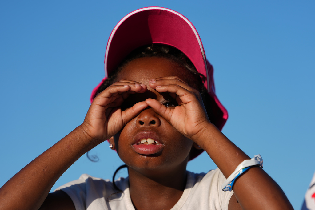 A child looks toward the stage before President Donald Trump speaks at the opening of the Great American State Fair on the National Mall, Wednesday, June 24, 2026, in Washington. (AP Photo/Julia Demaree Nikhinson)