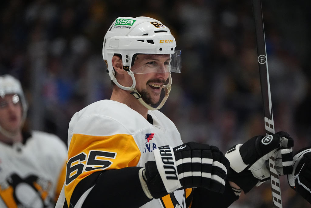 Pittsburgh Penguins defenseman Erik Karlsson reacts after scoring against the Colorado Avalanche in the second period of an NHL hockey game Monday, March 16, 2026, in Denver. (AP Photo/David Zalubowski)