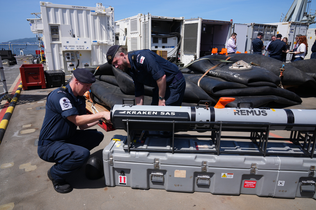 UK Royal Navy personnel inspect autonomous vehicles with sonar sensor that can detect and identify mines, on RFA Lyme Bay, in British Overseas Territory of Gibraltar, on Friday, May 22, 2026. (AP Photo/Kwiyeon Ha) CORRECTION: Location corrected to British Overseas Territory of Gibraltar, instead of territory of Gibraltar