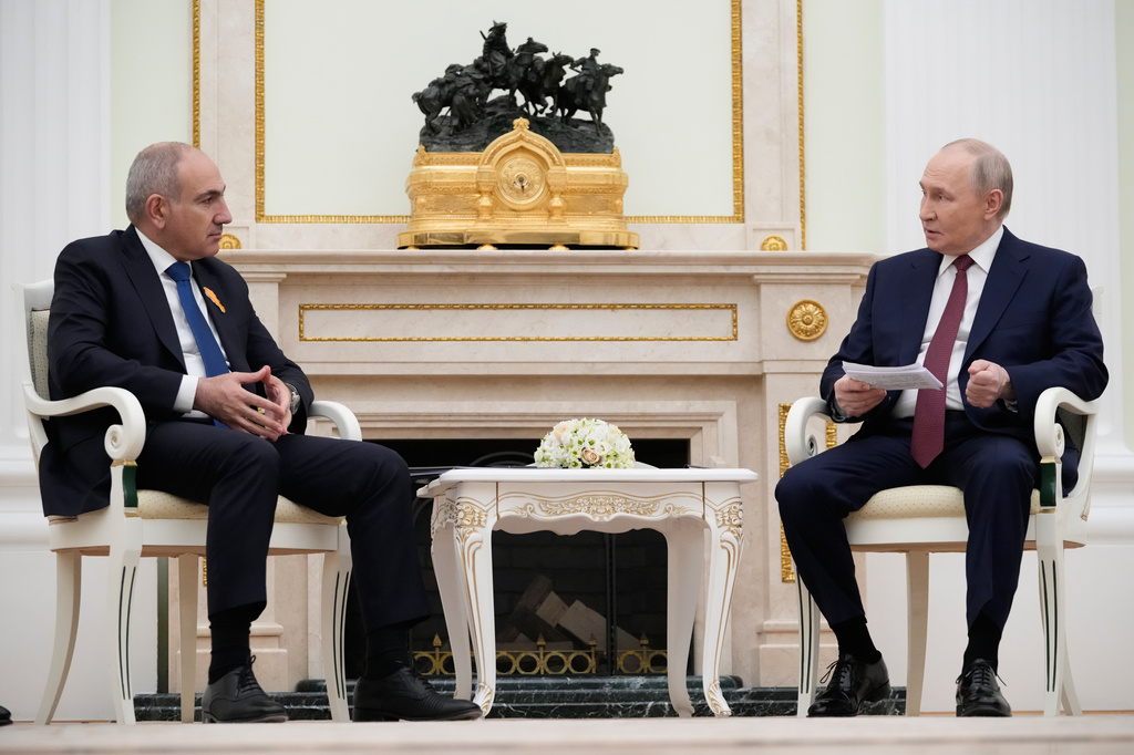 Russian President Vladimir Putin, right, speaks with Armenian Prime Minister Nikol Pashinyan at the Kremlin in Moscow, Wednesday, April 1, 2026. (AP Photo/Pavel Bednyakov, Pool)