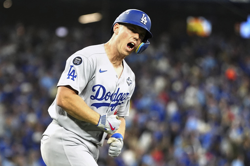 Los Angeles Dodgers' Will Smith (16) celebrates towards his dugout after hitting a solo home run against the Toronto Blue Jays during the seventh inning in Game 2 of baseball's World Series, Saturday, Oct. 25, 2025, in Toronto. (Frank Gunn/The Canadian Press via AP) Los Angeles Dodgers' Will Smith (16) celebrates towards his dugout after hitting a solo home run against the Toronto Blue Jays during the seventh inning in Game 2 of baseball's World Series, Saturday, Oct. 25, 2025, in Toronto. (Frank Gunn/The Canadian Press via AP)