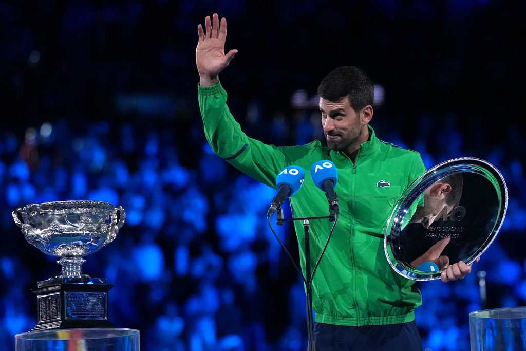 Novak Djokovic of Serbia waves during his speech following his loss to Carlos Alcaraz of Spain in the men's singles final at the Australian Open tennis championship in Melbourne, Australia, Sunday, Feb. 1, 2026. (AP Photo/Dita Alangkara)