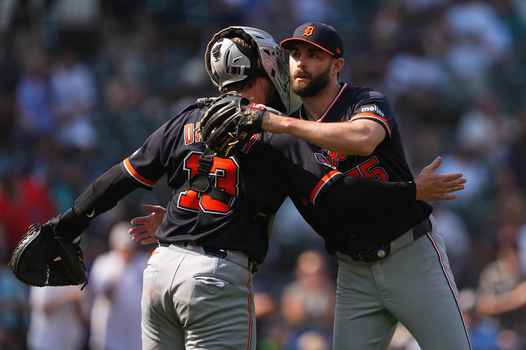 Detroit Tigers relief pitcher Brenan Hanifee, facing, greets catcher Dillon Dingler as they celebrate a win over the Seattle Mariners in a baseball game, Thursday, Aug. 6, 2026, in Seattle. (AP Photo/Lindsey Wasson)
