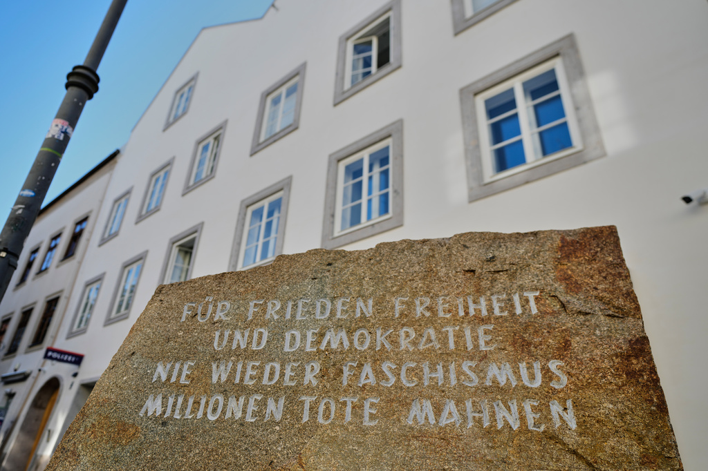 A new police station with a memorial stone reading "for peace, freedom and democracy, never again fascism, million dead remind" is located and will be officially opened in Adolf Hitler's birth house in Braunau am Inn, Austria, Wednesday, July 22, 2026. (AP Photo/Matthias Schrader)