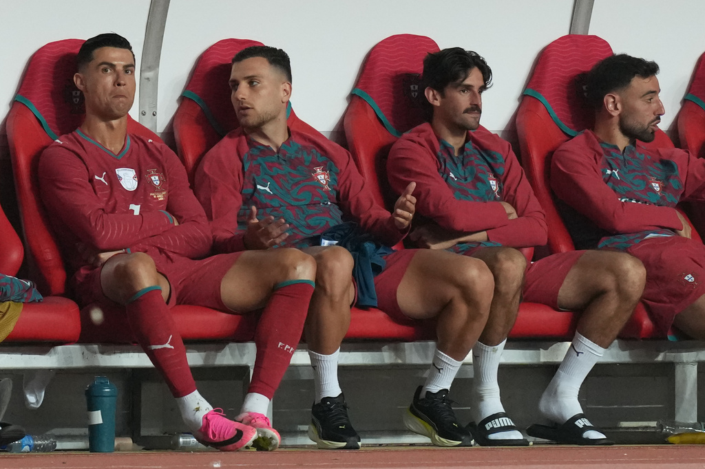Portugal's Cristiano Ronaldo, left, sits on the becnh after he was substituted during an international friendly soccer match between Portugal and Nigeria in Leiria, Portugal, Wednesday, June 10, 2026. (AP Photo/Ana Brigida)