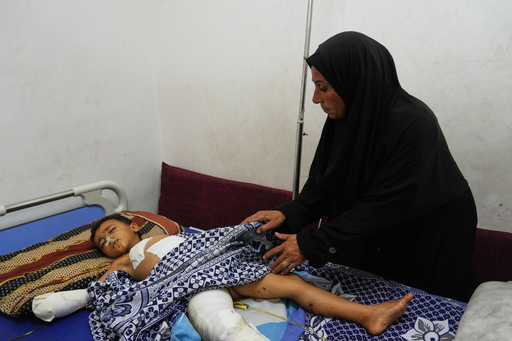 Hanan Shakshk cares her grandson Yahya Shorbasi, who was injured by an unexploded ordnance along with his six-year-old twin sister Nabila, at Shifa Hospital in Gaza City, Saturday, Oct. 25, 2025. (AP Photo/Abdel Kareem Hana) Hanan Shakshk cares her grandson Yahya Shorbasi, who was injured by an unexploded ordnance along with his six-year-old twin sister Nabila, at Shifa Hospital in Gaza City, Saturday, Oct. 25, 2025. (AP Photo/Abdel Kareem Hana)