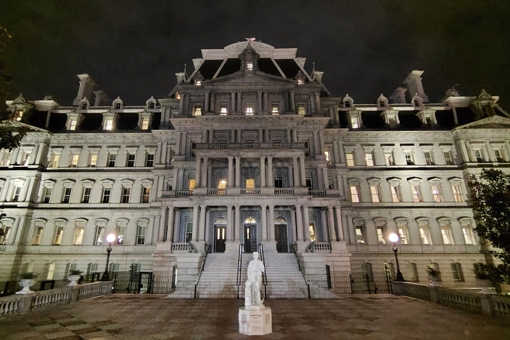 This photo provided by Will Hemsley shows a statue of Christopher Columbus standing in front of the Eisenhower Executive Office Building in Washington, Sunday, March 22, 2026. (Will Hemsley via AP)
